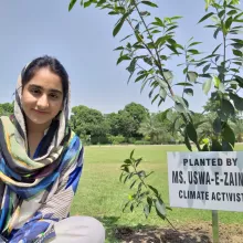 Uswa e Zainab planting a tree in a national park of Pakistan.