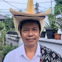 wearing a traditional hat and cloth of Rote, East Nusa Tenggara, Indonesia
