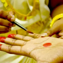 An Indian woman and professional dancer of the classical dance Bharata Natyam, getting the make-up and styling before her performance in India (Photo: GettyImages/Parimita Krishna)